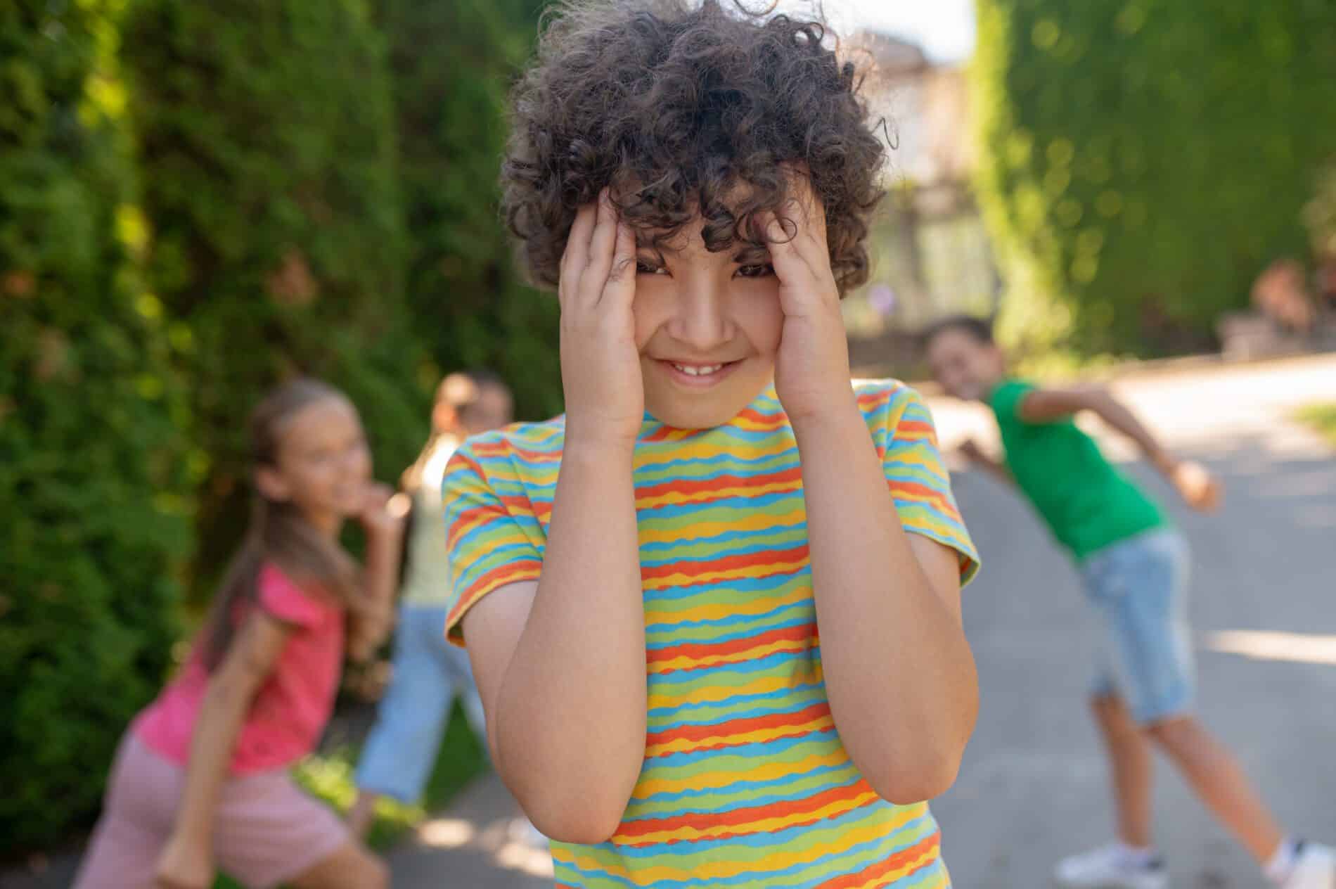 smiling boy covering face with palms and hiding fr 2023 11 27 05 04 53 utc scaled ADHD: Innovative Insights About Mental | Innovative Health