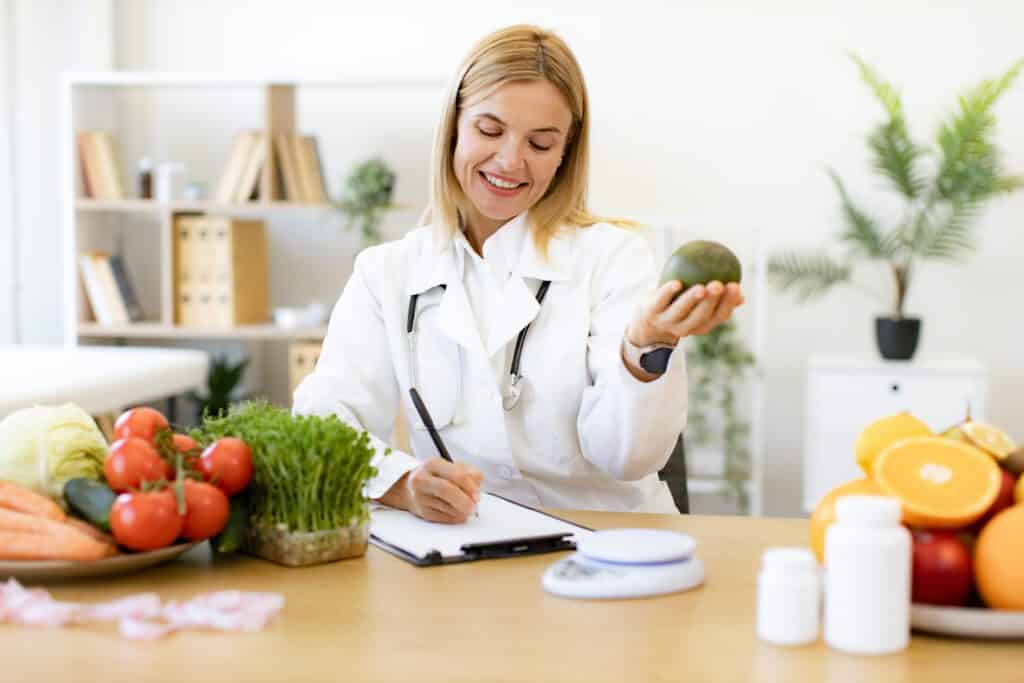 happy female writing prescription for patients pro 2024 05 21 23 46 43 utc No.1 Best in Dallas Functional Medicine- Innovative Health Group