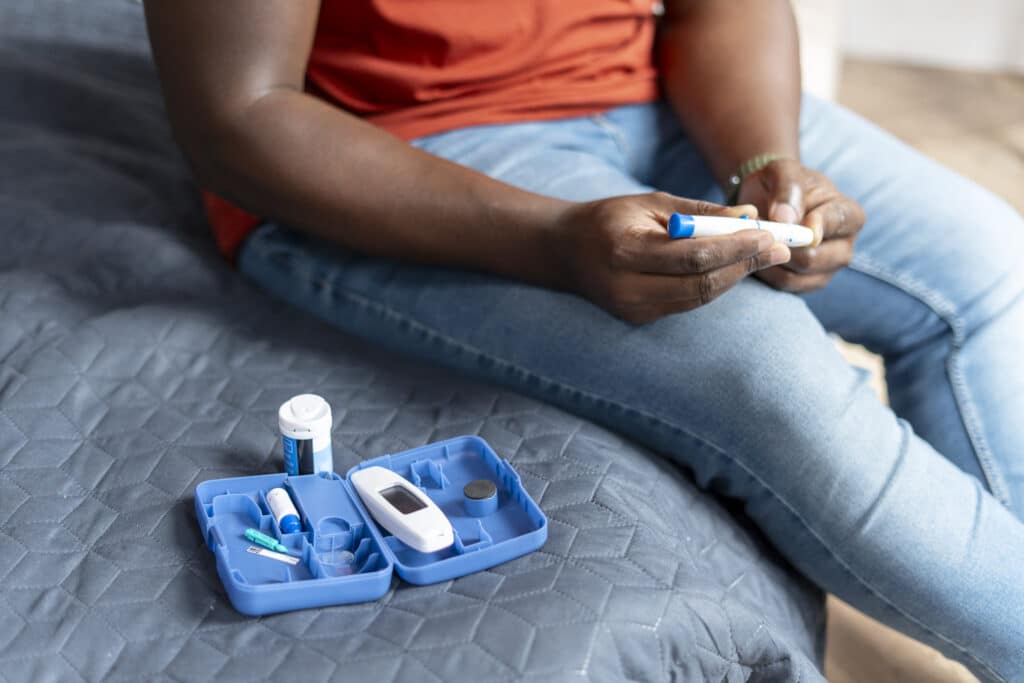 close up of african american man measuring sugar l 2024 12 18 15 58 30 utc 1 Conquer High Blood Sugar: A Holistic Guide for Hyperglycemia