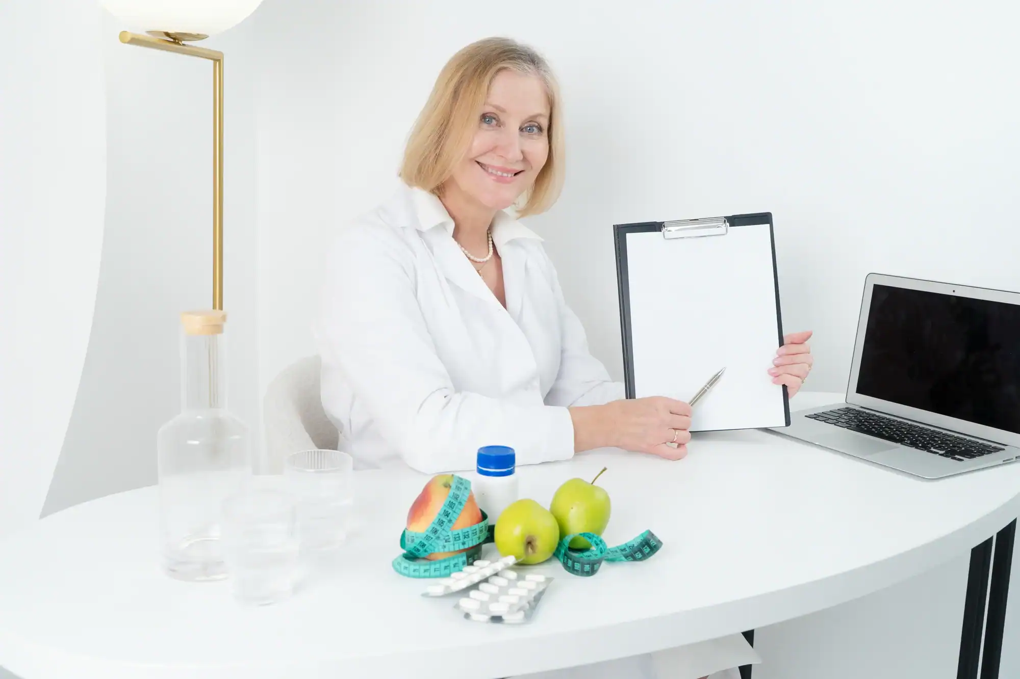 Hormone Imbalance 2 a woman sitting at a table Who to See for Hormone Imbalance